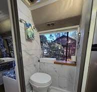 Where to put shower and toilet in a bus conversion?