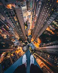 Top of tall building at night. Person Standing Top High Rise Building Foot Light Night Piqsels
