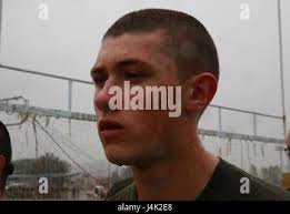 A recruit from Bravo Company, 1st Recruit Training Battalion, receives a  haircut at Marine Corps Recruit Depot San Diego, June 12. Recruits receive  haircuts regularly during training to create uniformity and promote