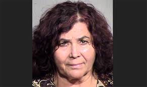 Woman arrested after 6 dead dogs found in Phoenix home, police say