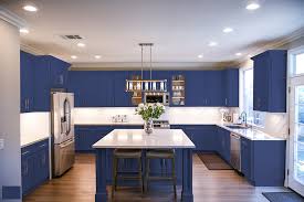 It should be a lot easier than removing paint, but you may have to use an aggressive stripper or chlorine bleach to remove the old stain. Easily Renew Your Kitchen With A Cabinet Refinish Diy Tutorial H D F Painting