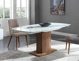 An easy to use extension mechanism and slimline tapered legs accommodate extra seats at the table for a spacious and comfortable gathering. Baobab Oval Glass White Extendable Kitchen Table