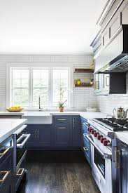 Try white countertops with your white cabinets for a fresh look. Farm Sink With Blue Kitchen Cabinets Contemporary Kitchen