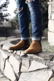 Check out our suede chelsea boots selection for the very best in unique or custom, handmade pieces from our boots shops. Person Wearing Brown Suede Chelsea Boots Standing Photo Free Apparel Image On Unsplash