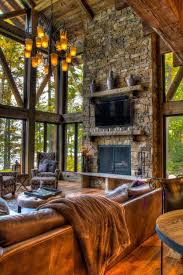 Floor To Ceiling Windows Welcomes Nature While The Rock Fireplace Invites You To Cozy Up To Today Unique House Design Rustic House Unique Houses