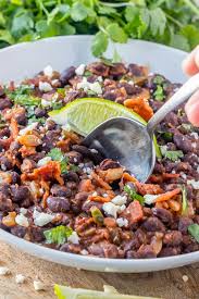 The key to perfectly cooked brown rice in the slow cooker is ensuring that the water evaporates slowly over the adding a layer of parchment paper directly over the water and rice mixture slows evaporation and makes sure every single grain is perfectly cooked. Easy Mexican Black Beans Yellowblissroad Com