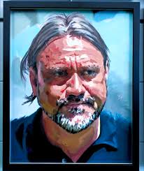 He's a face painter. Gotta support the team…