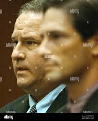 Beverly Hills real estate developer Mark Alan Abrams, 44, left, is shown  during his arriagnment in Wednesday, May 25, 2005, in Los Angeles. County  prosecutors charged Abrams Wednesday with laundering $21,000 in