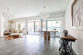 Living room floor tiles for white walls. Modern Living Room With Marble Tiles White Walls And Stylish Furnishings No One Inside Stock Photo Picture And Royalty Free Image Image 127196412