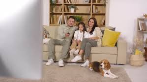 Living room designs ukc forums beagles. Beautiful Family Watching Tv In Living Room With Pets By Pressmaster