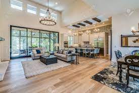 Maybe you would like to learn more about one of these? Two Story Great Room With Nice Chandelier And Large Glass Sliding Stock Photo Picture And Royalty Free Image Image 152883883