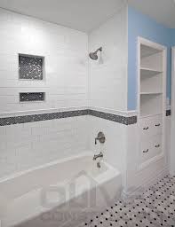 White With Black Accent Bathroom Subway Tile With Accent Border And Niches Surround The T Bathroom Tub Shower Combo Accent Tile Bathroom Trendy Bathroom Tiles