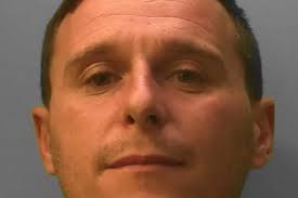 A 'most wanted' fugitive known as 'Scouse Carlos' chased man into shop and  stabbed him in head