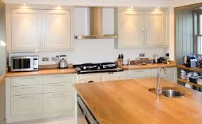 In A Classic Elegant Shade Of Cream The Traditional 3 Oven Aga Cooker Takes Pride Of Place In The Kitchen Matched Kitchen Design Traditional Kitchen Kitchen