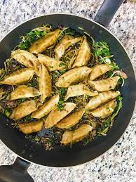 Easy Potstickers With Broccoli Kale Slaw And Spicy Homemade Sauce Recipe Kale Slaw Homemade Sauce Trader Joes Recipes Healthy