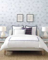 This Sophisticated Bedroom Has A Chic Look With Its Patterned Wallpaper Geometric Lamps Glass Side Tables Home Embroidered Duvet Cover Sophisticated Bedroom