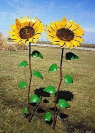 Pin By Debbi Michaelsrajala On Projects To Try Can Flowers Tin Flowers Recycled Garden Decor