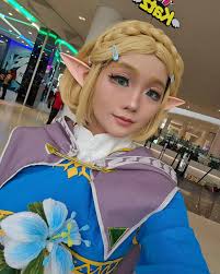 I cosplayed Zelda from Tears of the Kingdom at Asia Pop Con MY Big thank  you to Becky Lau for making the flower for me!!! Was worried I couldn't  pull her off