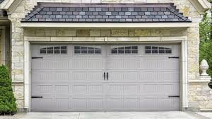 Garage door costs and options. Wood Vs Steel Garage Door Pros Cons Comparisons And Costs