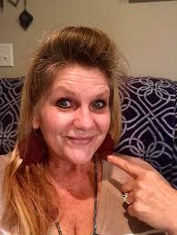 Puppy sitting detail with sleeping dog