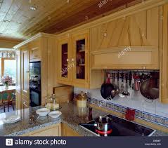 tiled wall above pan on halogen hob