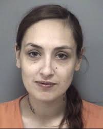 Woman charged with obstructing an officer in police shooting