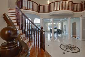 The dark wood steps constrast nicely with the white support pole and white balustrade. Selecting A Spindle Design For Your Stairway Asa Builders Supply