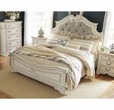 Get ashley furnitures realyn chipp. Signature Design Realyn Cal King Panel Bed Oversized By Ashley