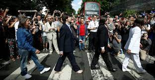 Abbey road is the eleventh studio album by the english rock band the beatles, released on 26 september 1969 by apple records.named after the location of emi studios in london, the cover features the group walking across the street's zebra crossing, an image that became one of the most famous and imitated in popular music. Fans Mark 50th Anniversary Of Beatles 039 Abbey Road Album Cover Ejinsight Ejinsight Com