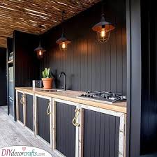 These 25 best ever diy outdoor serving stations/cart/table/bar that have all been made at home and are as functional as you want them to be! Outdoor Kitchen Cabinets Outdoor Kitchen Cabinet Ideas