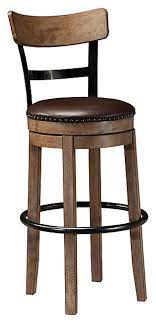 This bar stool is rustic in feel with modern appeal. Pinnadel Bar Height Bar Stool Ashley Furniture Homestore