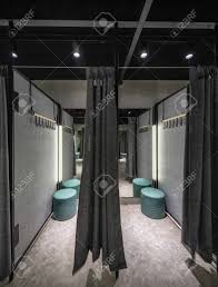 The walls and ceiling are white and create a clean backdrop for the beautiful furniture. Cabins With Dark Curtains In A Fitting Room With Black Ceiling Stock Photo Picture And Royalty Free Image Image 120575776