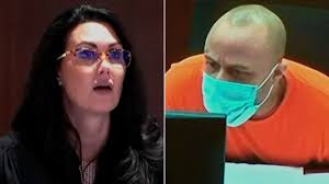 Attack suspect removes shirt during trial and clashes with judge