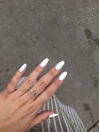 Flowers or studs on your accent nails will attract attention to your manicure. White Coffin Nails