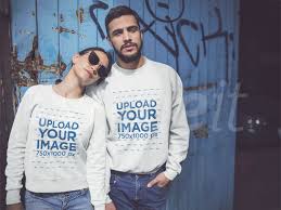 Placeit Happy Couple Wearing Different Crewneck Sweatshirts Mockup While Standing Against A Blue Door Sweatshirts Crew Neck Sweatshirt How To Wear