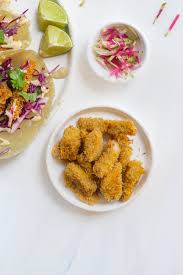 Place the fish pieces on a tray lined with parchment paper, then bake at 375 degrees for 5 minutes on each side. Paleo Fish Tacos Gluten Free Grain Free Holistic Foodie