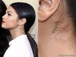 Selena gomez is an american singer and actress known for her starring role as alex russo on disney channel's wizards of waverly place.she began her acting career with barney and friends at age seven. Selena Gomez S Tattoos Meanings Steal Her Style