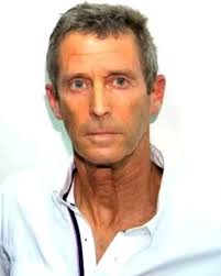 Who is the man in the picture related to Koidu Limited Mining?