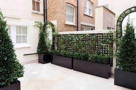 Wooden garden obelisks are the most common type. How To Transform Your Garden With Planters And Obelisks