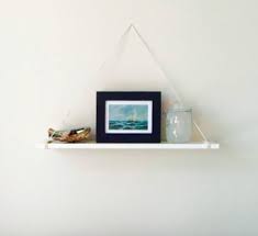 A Hanging Shelf With No Nails Screws Or Glue Is This Magic Wall Decor Bedroom Ikea Lack Shelves Floating Shelves Diy