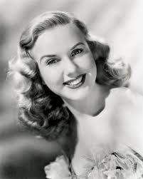 Deanna Durbin Sports The 1930s Long Finger Wave Style With Loose Curls 1940s Hairstyles 1930s Hair 1940s Hairstyles For Long Hair