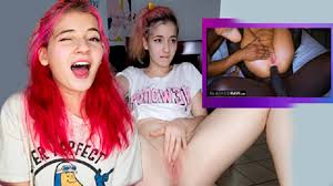 Petite masturbates while watching interracial video