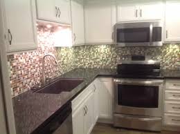 blue white kitchen with black granite