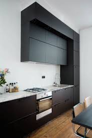 Black Ikea Kungsbacka Kitchen In A White Kitchen With High Ceilings In The Home Of Paulien Riemis Kitchen Marble Black Ikea Kitchen Kitchen With High Ceilings
