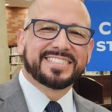 In 1973, my father earned his PhD in mathematics from Illinois Institute of  Technology. In 2001, I borrowed his cap and gown to wear as I collected my  PhD at Texas A&M.