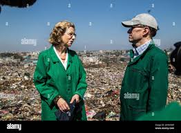 Inger Andersen, Executive Director of the United Nations Environment  Programme(UNEP) speaks with UN Environment Assembly President Espen Barth  Eide during a field trip to Dandora Dumping site ahead of the Fifth Session