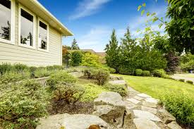 Landscape steel edging separates between rock garden and bark mulch. Unique Landscape Ideas That Use Rocks Jt S Landscaping