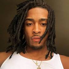 An old homeless black man with dreadlocks sitting on the street with a newspaper in his hand. 60 Incredible Hairstyles For Black Men To Copy 2021 Trends