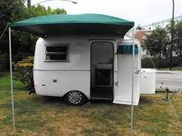 Boler With Green Awning Fiberglass Camper Trillium Trailer Boler Trailer Vintage Travel Trailers Caravans Recreational Vehicles