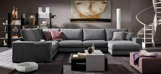 The sofa is covered in leather with a distinctively smooth and subtle touch. Domino Natuzzi Italia